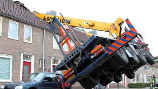 54850_crane_topples_on_to_house_640x360_epa_nocredit