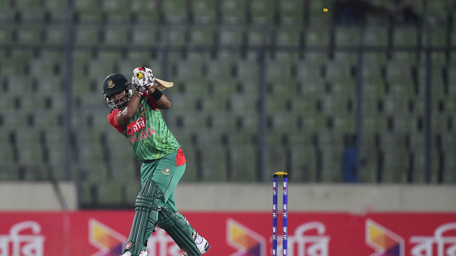 Bangladesh cricketer Litton Das is bowled by South African cricketer Kagiso Rabada during the second One Day International match between Bangladesh and South Africa at the Sher-e-Bangla National Cricket Stadium in Dhaka on July 12, 2015. AFP PHOTO/ Munir uz ZAMAN        (Photo credit should read MUNIR UZ ZAMAN/AFP/Getty Images)